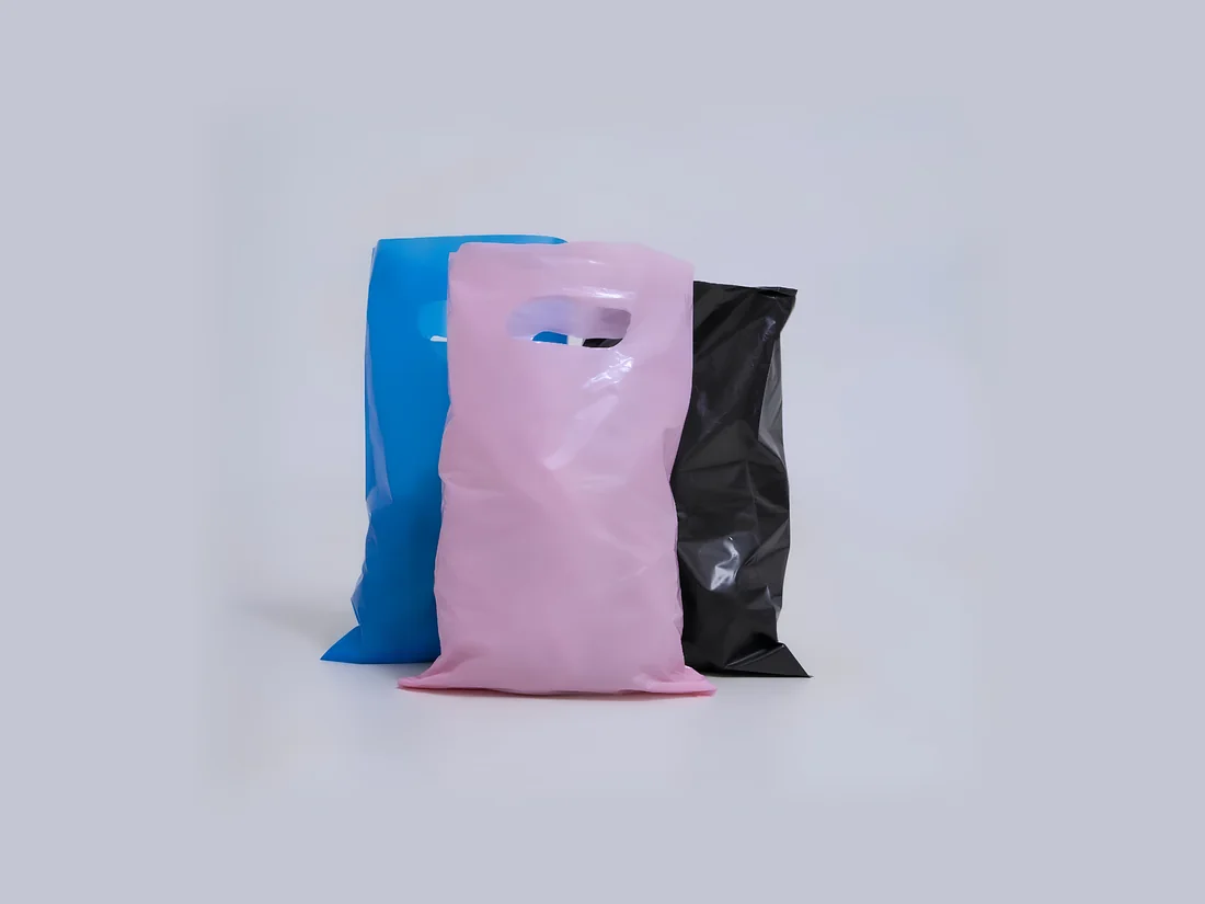 Blue, pink and black die-cut handle boutique bags